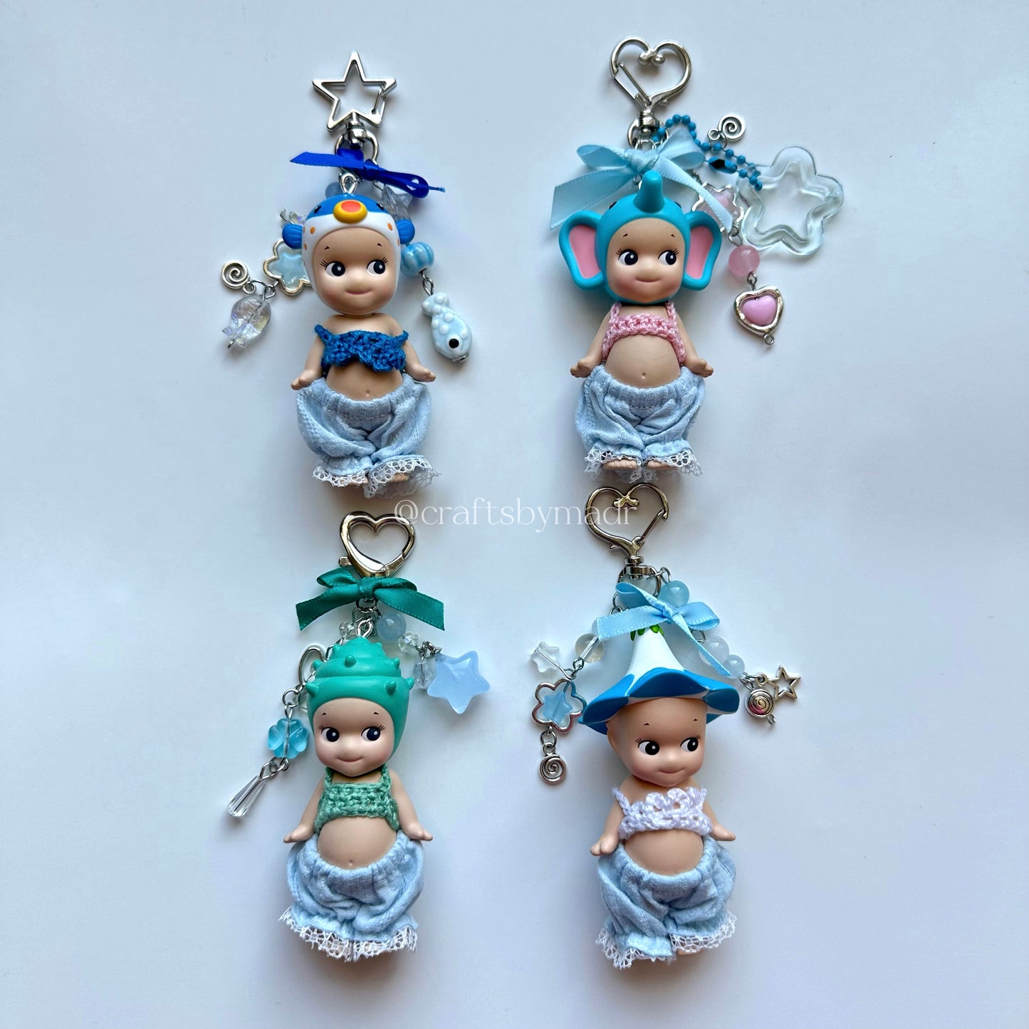blue sonny angel keychains with crochet tops and blue pants