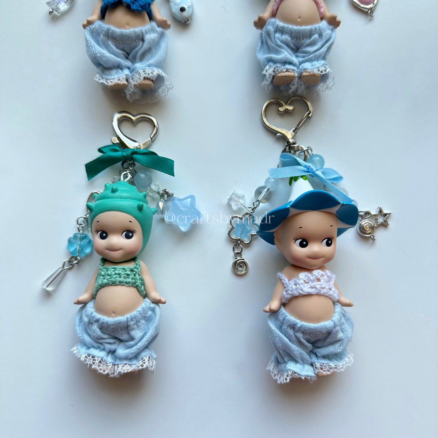blue sonny angel keychains with crochet tops and blue pants