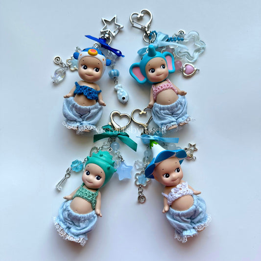 blue sonny angel keychains with crochet tops and blue pants